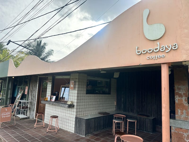 The shopfront with the Boodaya coffee sign and bar stools at Boodaya Coffee Ubud
