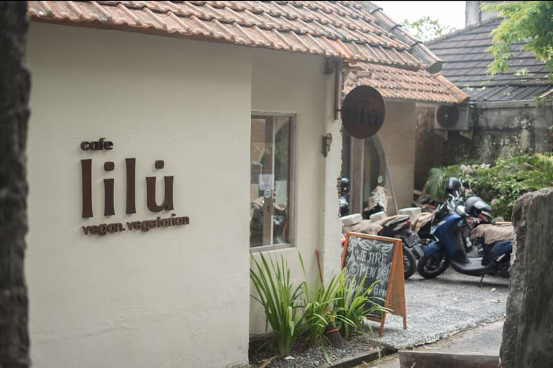 The entrance sign reading cafe Lilu vegan vegetarian at Cafe Lilu
