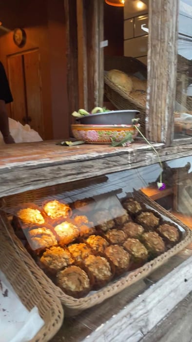 Baskets of buns and pastries in the display window at Roti Bohemia