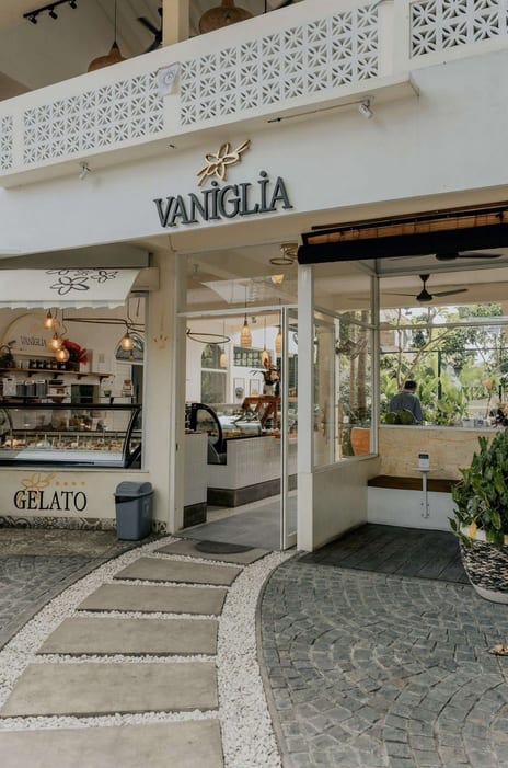 The white shopfront with the Vaniglia sign and gelato counter at Vaniglia Gelato and Pastry
