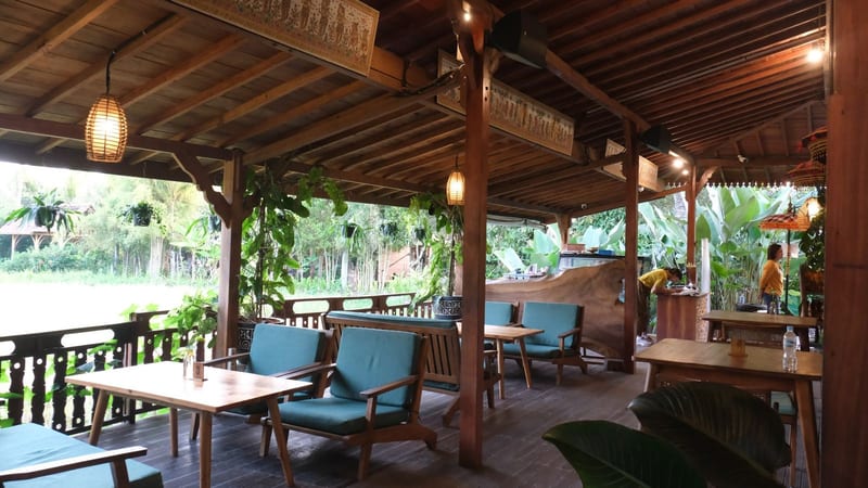The open-sided dining pavilion looking out over rice fields at Wedja Restaurant