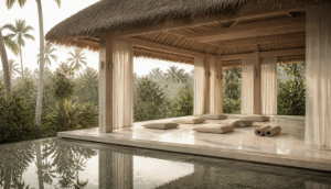 An open-air timber yoga pavilion at a Bali retreat, with floor cushions and jungle beyond